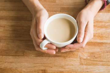 woman hold a cup a coffee