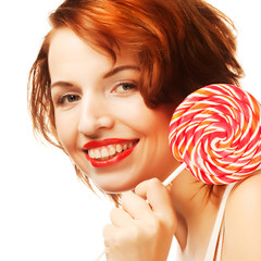 Pretty young woman holding lolly pop. Isolated on white.