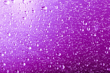 Drops of water on a color background. Gray. Shallow depth of field. Selective focus. Blur.
