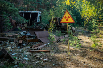 sign of radiation hazard on the background of radioactive garbage