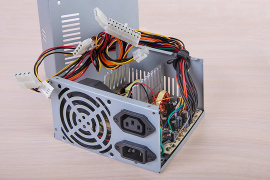 Computer power supply.Gray PCU.Inside view.PC component.