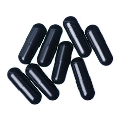 Capsule pills medicine pharmacy black on white background isolation, top view