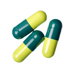 Pills capsule medicine pharmacy green on white background isolation, top view