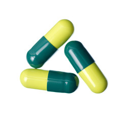 Pills capsule medicine pharmacy green on white background isolation, top view