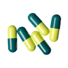 Pills capsule medicine pharmacy green on white background isolation, top view