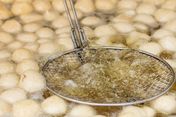 Greek donuts in oil ,Traditional turkish pastry: Lokma