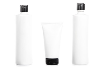 Studio shot of plastic bottles and cream tube isolated on white