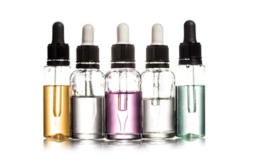 Studio shot of serum in glass bottles isolated on white