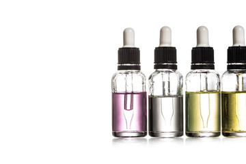 Studio shot of serum in glass bottles isolated on white