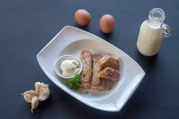 Pancakes on a white plate. Milk, eggs, farm products.