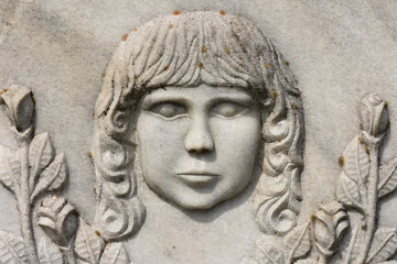 BISTRITA, ROMANIA, statue in cemetery,  BABY  FACE   SCULPTURE