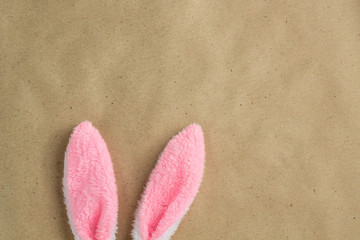 Top view of decoration symbol Happy Easter holiday. Bunny Ears on rustic Background concept. Free space for design.