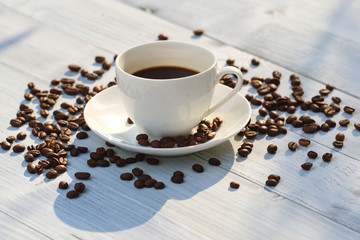 Coffee cup and coffee beans on the table 