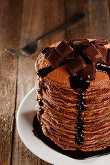 Dark chocolate melts on pancakes