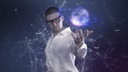 A male scientist in a white shirt holds an abstract ball in his hands against a background of plexus