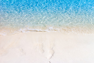 Fototapeta na wymiar Wave of the sea on the sand beach.Tropical beach with Blue sky and clear sea.