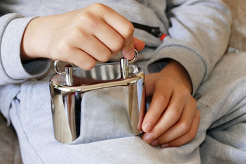 piggy bank and child, a child has a metal piggy bank in his hand,