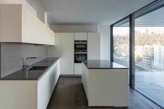 Front view of modern white kitchen