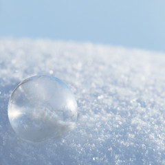 Soap bubbles in the snow, copy space