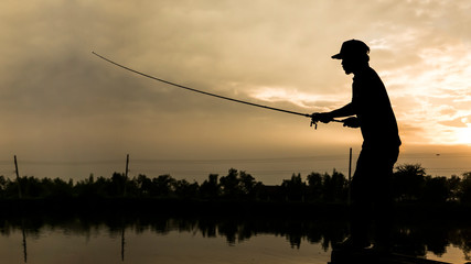 The man casting  fishing rod