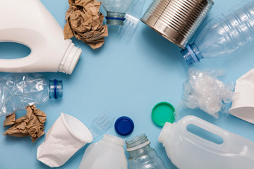 Top view of rubbish for recycling on a blue background