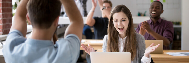 Horizontal concept photo happy coworkers clap hands congratulate each other with business success...