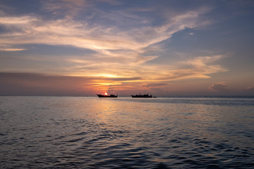Ships in sunset