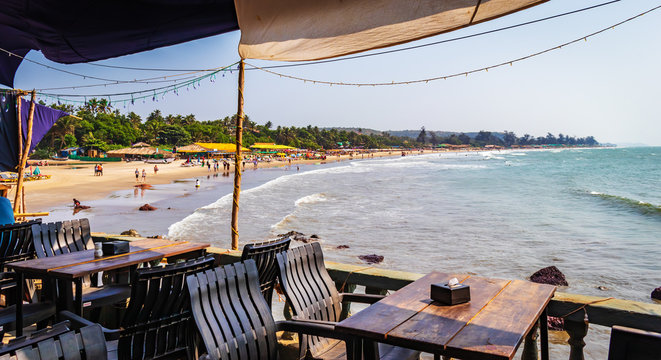 Sea View Restaurant Summer Pavilion Or Terrace Interior With Open beach view in Goa India with  Furniture baga beach. perfect view if beach side restaurants 