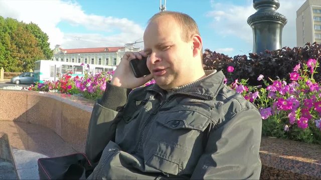 Confident young man talking with friends