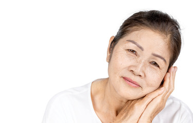 old asian woman in studio head shot with beauty or serenity concept