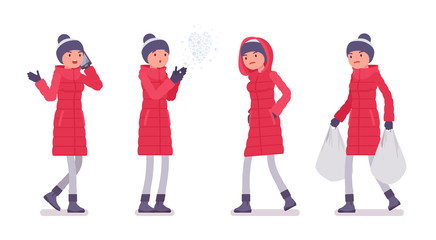 Stylish woman in long red down jacket on a street