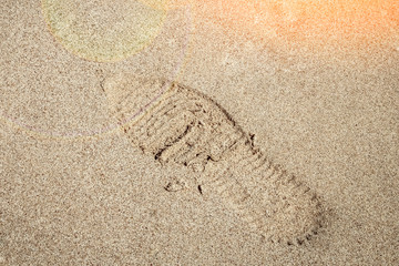 Beautiful footprints in the sand sea nature background