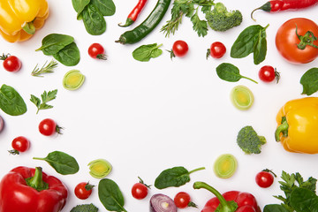 Flat lay with organic vegetables on white background