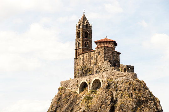 Le Puy-en-Velay, France. Saint Michel d'Aiguilhe Chapel, built in volcanic plug, a World Heritage Site as part of the Routes of Santiago de Compostela