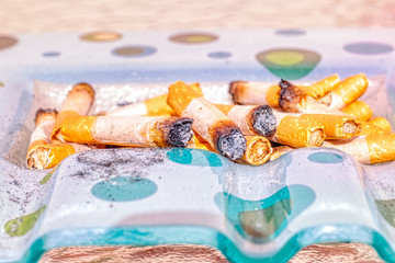 Ashtray full of cigarette butts