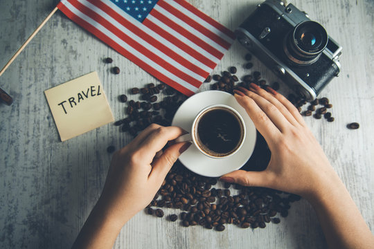 woman hand coffee with travel concept on table