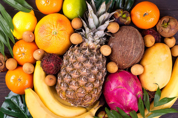Tropical fruits background, many colorful ripe tropical fruits