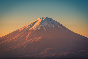 The peak of Mt. Fuji at sunrise in Fujikawaguchiko, Japan.