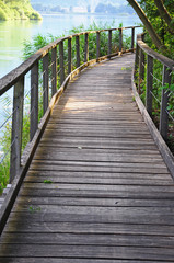 Wooden path and lake water