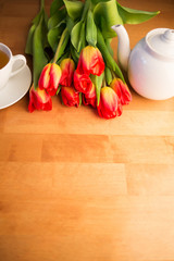 spring flowers and a Cup of tea in the morning. international women's day or mother's day