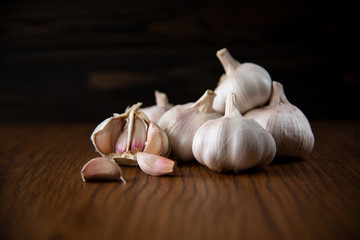 Garlic bulb on the wooden vintage background