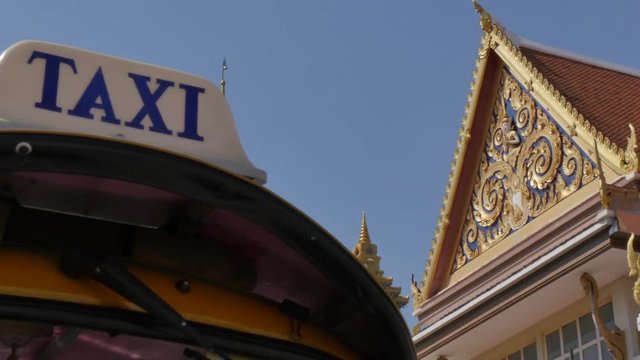 Taxi sign on tuk-tuk and Wat Saket (Golden Mount), Bangkok, Thailand, Southeast Asia, Asia