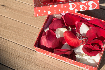 Red & White Rose petals inside the gift box, Valentine's Day greeting card, Top view on romantic composition, Romanace concepts