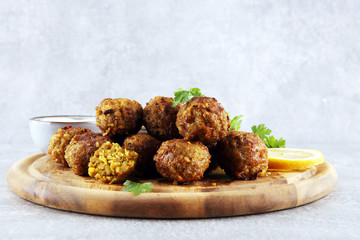 Traditional homemade hummus, falafel and chickpea served with spices on table. Jewish Cuisine.