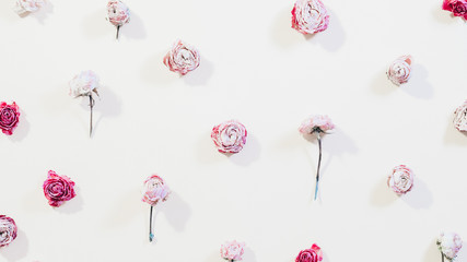 Floral pattern design. Minimal flower composition. Assorted rose heads on ivory background.