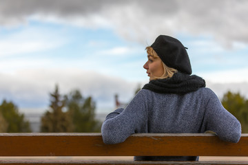 young and blonde girl with casual clothes in the city