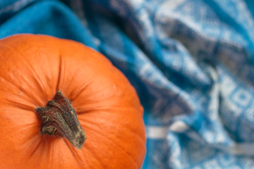 Fresh farmer pumpkin on the blue cotton tablecloth