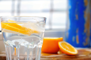 fresh water drink with ice and lemon slices 