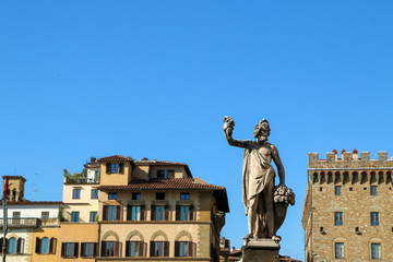 Some old italian houses and one antique statue in Florence in Italy. A detail of the architecture and style.  