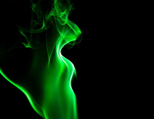 Obraz premium Green smoke on black background